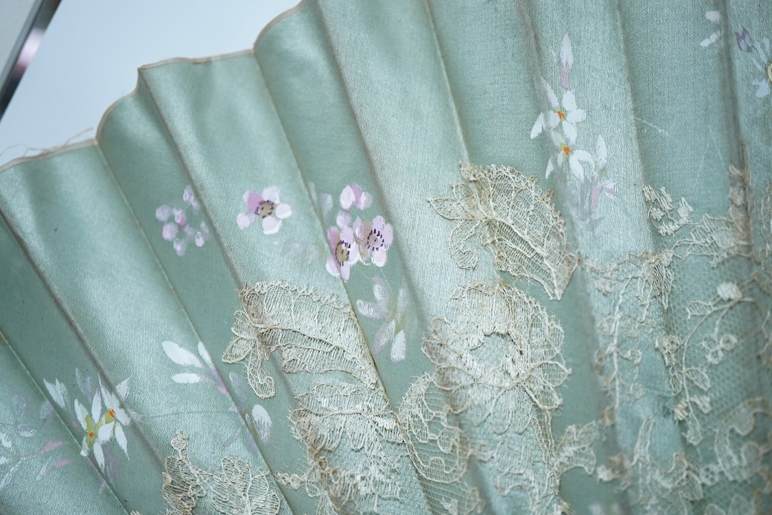 A collection of 19th century and later fans to include a black lacquered and lace example and a hand painted floral example